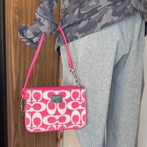 Coach EUC pink and cream, monogrammed wristlet with hang tag